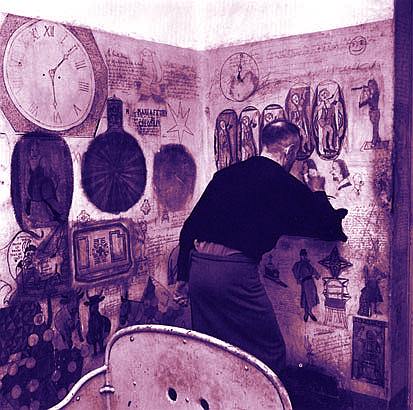 Mad man at a wall, filled with drawings of pots and people, clock 6 past 6