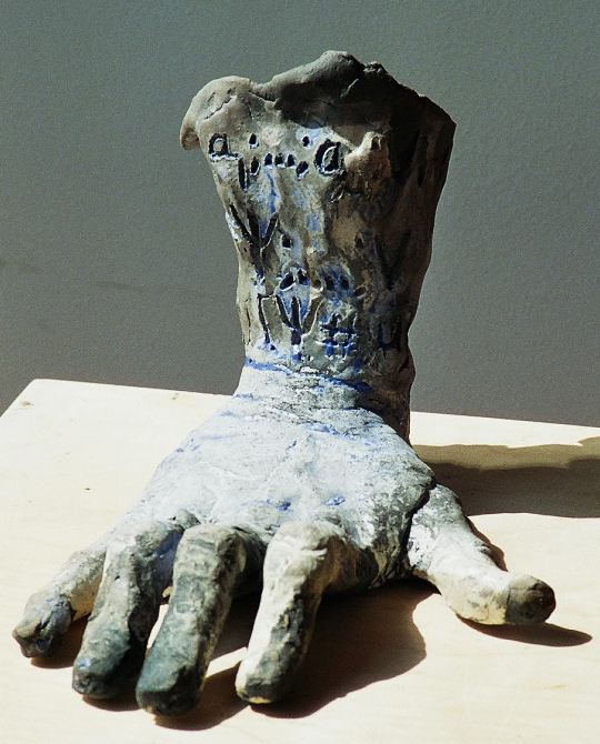 Ceramic hand with mathematical inscription
